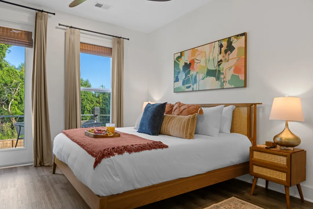 The Sunset Room with a king bed and warm neutral bedding