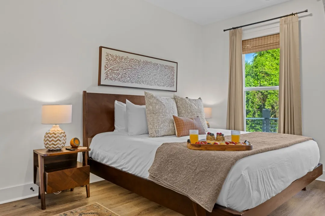 Balcony Room with a king bed and a bright window